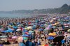 People visit Bournemouth beach, south England, Monday May 25, 2026. (Andrew Matthews/PA via AP)