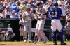 New York Yankees left fielder Cody Bellinger, center, runs home to score after hitting a solo home run during the second inning of baseball game against the Kansas City Royals, Monday, May 25, 2026, in Kansas City, Mo. (AP Photo/Charlie Riedel)