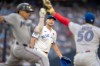 Toronto Blue Jays pitcher Trey Yesavage (39) watches as his throw to first baseman Lenyn Sosa (50) puts out Miami Marlins Javier Sanoja (8) during first inning MLB action in Toronto on Monday May 25, 2026. THE CANADIAN PRESS/Frank Gunn