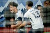 Vancouver Whitecaps' Sebastian Berhalter (16) celebrates his goal against the Portland Timbers with Thomas Muller (13) during the second half of an MLS soccer match in Vancouver, on Saturday, April 4, 2026. THE CANADIAN PRESS/Ethan Cairns