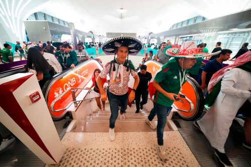 FILE - Mexico soccer fans exit the metro station on their way to a World Cup group C soccer match between Saudi Arabia and Mexico, at the Lusail Stadium in Lusail, Qatar, Wednesday, Nov. 30, 2022. (AP Photo/Julio Cortez, File)