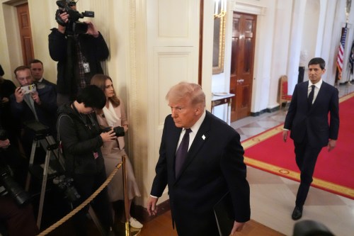 President Donald Trump, left, and Kevin Warsh arrive at a swearing-in ceremony for Warsh as Chairman of the Federal Reserve in the East Room of the White House, Friday, May 22, 2026, in Washington. (AP Photo/Alex Brandon)