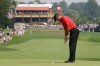 FILE - Tiger Woods taps in his par putt on the first hole during the final round of the Bridgestone Invitational golf tournament at Firestone Country Club in Akron, Ohio, Aug. 7, 2011. (AP Photo/Mark Duncan, File)