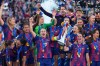 Barcelona's Alexia Putellas celebrates with the trophy after winning the Women's Champions League final soccer match between FC Barcelona and OL Lyonnes, in Oslo, Saturday, May 23, 2026. (AP Photo/Kirsty Wigglesworth)