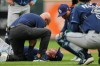 Tampa Bay Rays starting pitcher Griffin Jax is examined by a trainer after an injury during the second inning of a baseball game against the Baltimore Orioles, Tuesday, May 26, 2026, in Baltimore. (AP Photo/Stephanie Scarbrough)