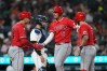 Los Angeles Angels' Vaughn Grissom (5) celebrates his grand slam with Logan O'Hoppe (14) and Zach Neto (9) against the Detroit Tigers during the eighth inning of a baseball game Tuesday, May 26, 2026, in Detroit. (AP Photo/Paul Sancya)
