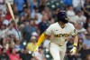 Milwaukee Brewers' Garrett Mitchell flips his bat after hitting a three-run home run during the fifth inning of a baseball game against the St. Louis Cardinals, Tuesday, May 26, 2026, in Milwaukee. (AP Photo/Aaron Gash)
