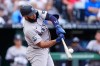 New York Yankees' Amed Rosario hits a two-run home run during the first inning of baseball game against the Kansas City Royals, Tuesday, May 26, 2026, in Kansas City, Mo. (AP Photo/Charlie Riedel)