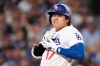 Los Angeles Dodgers' Shohei Ohtani reacts after being hit by a pitch during the fourth inning of a baseball game against the Colorado Rockies, Tuesday, May 26, 2026, in Los Angeles. (AP Photo/Mark J. Terrill)