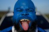 Brenton Balentien, known as Blue Face, a leader of soccer fans of Curacao's national soccer team, cheers in Willemstad, Saturday, May 16, 2026. (AP Photo/Matias Delacroix)