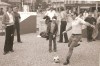 In this photo provided by the Hunt family, Lamar Hunt kicks a ball at a World Cup fan plaza in Dusseldorf, Germany, during the 1974 soccer tournament. (Hunt Family via AP)