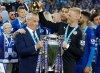 FILE - Leicester City team manager Claudio Ranieri has the crown of the trophy placed on his head by Leicester goalkeeper Kasper Schmeichel as they celebrate becoming the English Premier League soccer champions at King Power stadium in Leicester, England, May 7, 2016. (AP Photo/Matt Dunham, File)