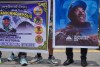 Friends and family members wait as renowned Sherpa mountain guide Kami Rita, returning from Mount Everest after his record 32nd successful ascent, arrives in Kathmandu, Nepal, Friday, May 22, 2026. (AP Photo/Niranjan Shrestha)