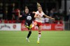 United States defender Emily Sonnett, left, and Canada forward Jordyn Huitema (9) battle for the ball during the first half of an international friendly soccer match, Wednesday, July 2, 2025, in Washington. (AP Photo/Nick Wass)