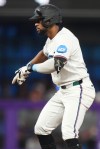 Miami Marlins' Otto Lopez reacts after hitting a double during the third inning of a baseball game against the New York Mets, Saturday, May 23, 2026, in Miami. (AP Photo/Lynne Sladky)
