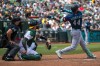 Seattle Mariners' Julio Rodríguez (44) hits a home run during the eighth inning of a baseball game against the Athletics in West Sacramento, Calif., Wednesday, May 27, 2026. (AP Photo/Nic Coury)