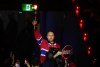 Former Montreal Canadiens goaltender Jaroslav Halak holds a torch prior to Montreal Canadiens first period NHL playoff hockey action against the Carolina Hurricanes in Montreal on Wednesday May 27, 2026. THE CANADIAN PRESS/Christinne Muschi