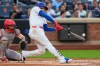 New York Mets' Juan Soto hits a home run during the first inning of a baseball game against the Cincinnati Reds, Wednesday, May 27, 2026, in New York. (AP Photo/Yuki Iwamura)