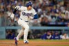 Los Angeles Dodgers' Shohei Ohtani runs to first as he grounds out during the third inning of a baseball game against the Colorado Rockies, Tuesday, May 26, 2026, in Los Angeles. (AP Photo/Mark J. Terrill)