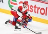 Carolina Hurricanes' Alexander Nikishin (21) pushes Montreal Canadiens' Josh Anderson (17) to the ice during third period of Game 4 of the NHL Eastern Conference final Stanley Cup playoff series action in Montreal on Wednesday, May 27, 2026. THE CANADIAN PRESS/Graham Hughes