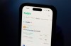 FILE - A phone displays crypto prices on the Kalshi app on April 16, 2026, in Portland, Ore. (AP Photo/Jenny Kane, File)