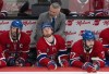 Canadiens captain Nick Suzuki (14) alongside forwards Cole Caufield (13) and Kirby Dach (77) watch the final minutes tick down against the Carolina Hurricanes in front of head coach Martin St. Louis in Montreal on Wednesday, May 27, 2026. THE CANADIAN PRESS/Christinne Muschi