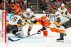 Anaheim Ducks right wing Beckett Sennecke, second from right, scores as Vegas Golden Knights goaltender Carter Hart, left, watches and defenseman Rasmus Andersson, second from left, and center Colton Sissons try to defend during the third period in Game 3 of a second-round NHL hockey Stanley Cup playoff series Friday, May 8, 2026, in Anaheim, Calif. (AP Photo/Mark J. Terrill)