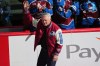 Claude Lemieux waves as he is introduced during a ceremony to honor members from the 1996 Stanley Cup Championship team of the Colorado Avalanche before an NHL hockey game against the Florida Panthers Thursday, Dec. 11, 2025, in Denver. (AP Photo/David Zalubowski)