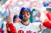 Philadelphia Phillies' Bryce Harper is congratulated in the dugout after he hit a solo home run in the first inning of a baseball game against the Colorado Rockies, Sunday, May 10, 2026, in Philadelphia. (AP Photo/Laurence Kesterson)