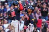 Atlanta Braves' Ozzie Albies, right, is congratulaed by Matt Olson (28) after his two-run home run in the ninth inning of a baseball game, Thursday, May 28, 2026, in Boston. (AP Photo/Charles Krupa)