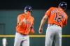 Houston Astros' Isaac Paredes celebrates a home run with Houston Astros' third base coach Tony Perezchica during the first inning of a baseball game against the Texas Rangers, Thursday, May 28, 2026, Arlington, Texas. (AP Photo/Jessica Tobias)