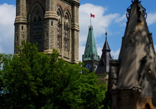 The Canadian flag blows on the Peace Tower on Parliament Hill in Ottawa on Tuesday, May 26, 2026. THE CANADIAN PRESS/Sean Kilpatrick