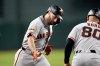 San Francisco Giants' Casey Schmitt, left, celebrates his home run against the Arizona Diamondbacks with Giants third base coach Hector Borg (80) during the first inning of a baseball game, Wednesday, May 20, 2026, in Phoenix. (AP Photo/Ross D. Franklin)