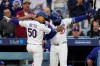 Los Angeles Dodgers' Mookie Betts, left, and Teoscar Hernández celebrate after Betts hit a two-run home run during the first inning of a baseball game against the Colorado Rockies, Tuesday, May 26, 2026, in Los Angeles. (AP Photo/Mark J. Terrill)