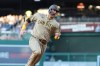 San Diego Padres' Gavin Sheets runs to score on a single hit by Manny Machado off Washington Nationals pitcher Andrew Alvarez during the third inning of a baseball game, Friday, May 29, 2026, in Washington. (AP Photo/Terrance Williams)