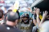 San Diego Padres' Fernando Tatis Jr. celebrates with his teammates after hitting a home run during the fifth inning of a baseball game against the Washington Nationals, Saturday, May 30, 2026, in Washington. (AP Photo/Daniel Kucin Jr.)