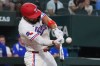 Texas Rangers' Ezequiel Duran hits a walkoff single that scored teammate Brandon Nimmo in the ninth inning of a baseball game against the Kansas City Royals, Saturday, May 30, 2026, in Arlington, Texas. (AP Photo/LM Otero)
