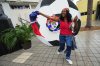 Odeline Paul dances with a Haitian flag at a Haitian Heritage Month event featuring the Haiti national soccer team, Saturday, May 30, 2026, in North Miami, Fla., ahead of the FIFA World Cup soccer tournament. (AP Photo/Lynne Sladky)