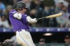 Colorado Rockies' Jake McCarthy connects for a two-run home run off San Francisco Giants starting pitcher Adrian Houser in the fourth inning of a baseball game Saturday, May 30, 2026, in Denver. (AP Photo/David Zalubowski)