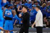 San Antonio Spurs head coach Mitch Johnson, center, talks with Oklahoma City Thunder guard Shai Gilgeous-Alexander (2) as Thunder head coach Mark Daigneault looks on during the second half of Game 7 of the Western Conference finals of the NBA basketball playoffs series Saturday, May 30, 2026, in Oklahoma City. (AP Photo/Tony Gutierrez)