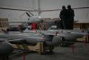 Servicemen of Ukraine's defense intelligence set up drones against Russian in an undisclosed location in Ukraine late Thursday, May 28, 2026. (AP Photo/Efrem Lukatsky)
