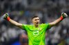 FILE - Argentina's goalkeeper Emiliano Martinez celebrates after he saved a penalty kick during the penalty shootouts in the World Cup final soccer match between Argentina and France at the Lusail Stadium in Lusail, Qatar, Sunday, Dec. 18, 2022. (AP Photo/Petr David Josek File)