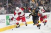 FILE - Carolina Hurricanes left wing Eric Robinson (50) and Vegas Golden Knights center Colton Sissons (10) battle for the puck during the first period of an NHL hockey game, Oct. 20, 2025, in Las Vegas. (AP Photo/Candice Ward, file)