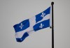 The Quebec Fleur-de-lis provincial flag flies on top of the National Assembly’s main tower, Wednesday, Jan. 18, 2023 in Quebec City. THE CANADIAN PRESS/Jacques Boissinot