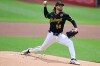 Pittsburgh Pirates starting pitcher Carmen Mlodzinski delivers during the first inning of a baseball game against the Chicago Cubs, Monday, May 25, 2026, in Pittsburgh. (AP Photo/David Dermer)