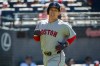 Boston Red Sox's Masataka Yoshida reacts after scoring on an RBI single by Isiahh Kiner-Falefa during the seventh inning of a baseball game against the Cleveland Guardians, Sunday, May 31, 2026, in Cleveland. (AP Photo/Phil Long)