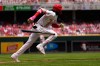 Cincinnati Reds shortstop Elly de la Cruz runs to first base after hitting a single during the fifth inning of a baseball against the Atlanta Braves game in Cincinnati, Sunday, May 31, 2026. (AP Photo/Carolyn Kaster)