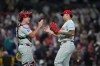 Philadelphia Phillies pitcher Jhoan Duran, right, celebrates with catcher J.T. Realmuto after the Phillies defeated the San Diego Padres 4-3 in a baseball game Tuesday, May 26, 2026, in San Diego. (AP Photo/Gregory Bull)
