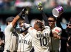 From left to right, Seattle Mariners' Jhonny Pereda, Colt Emerson, Victor Robles and Julio Rodriguez celebrate after a baseball game against the Arizona Diamondbacks, Sunday, May 31, 2026, in Seattle. (AP Photo/Stephen Brashear)
