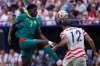 United States defender Miles Robinson (12) heads the ball away from Senegal forward Assane Diao (7) during the second half of an international friendly soccer match Sunday, May 31, 2026, in Charlotte, N.C. (AP Photo/Scott Kinser)